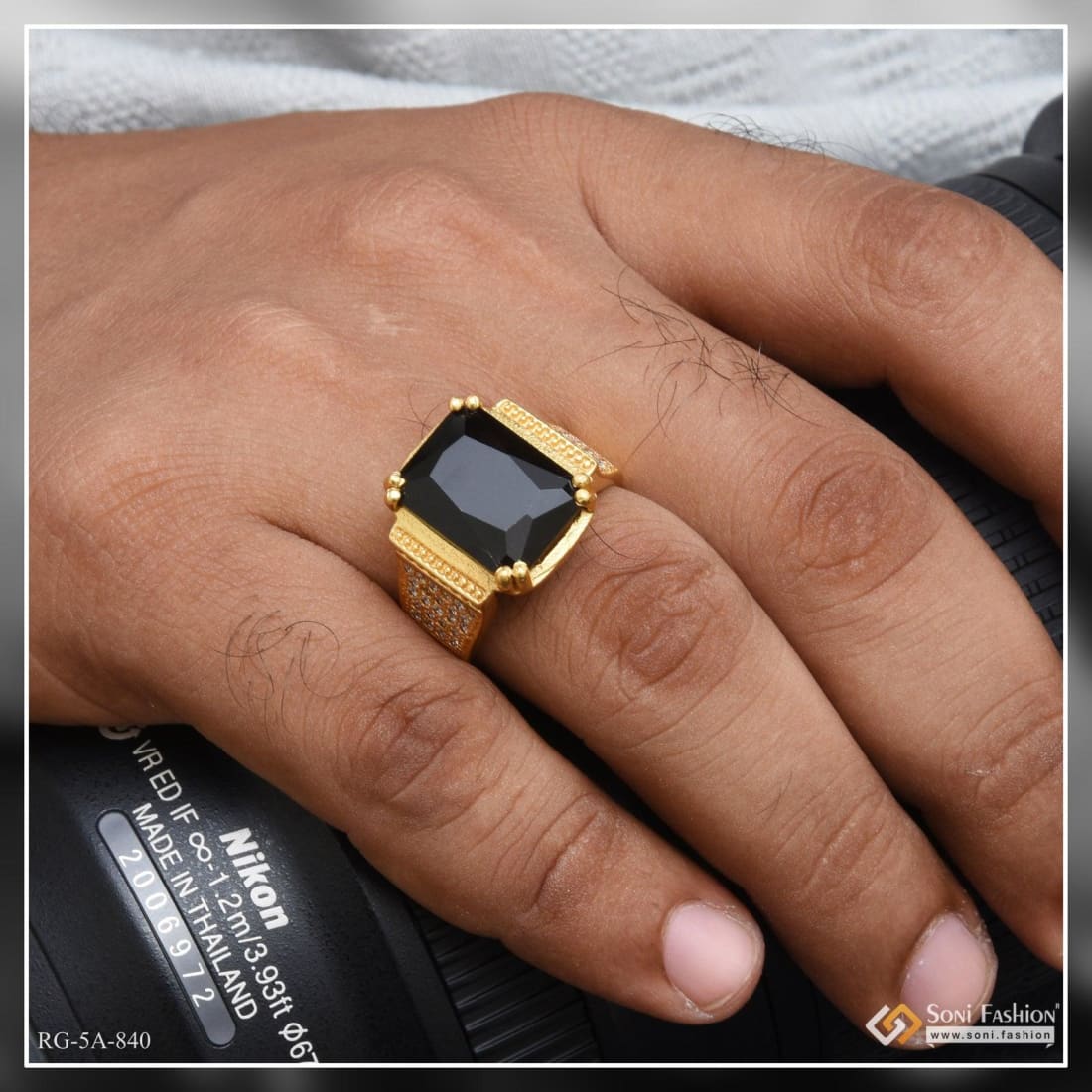 Black stone in gold shop ring