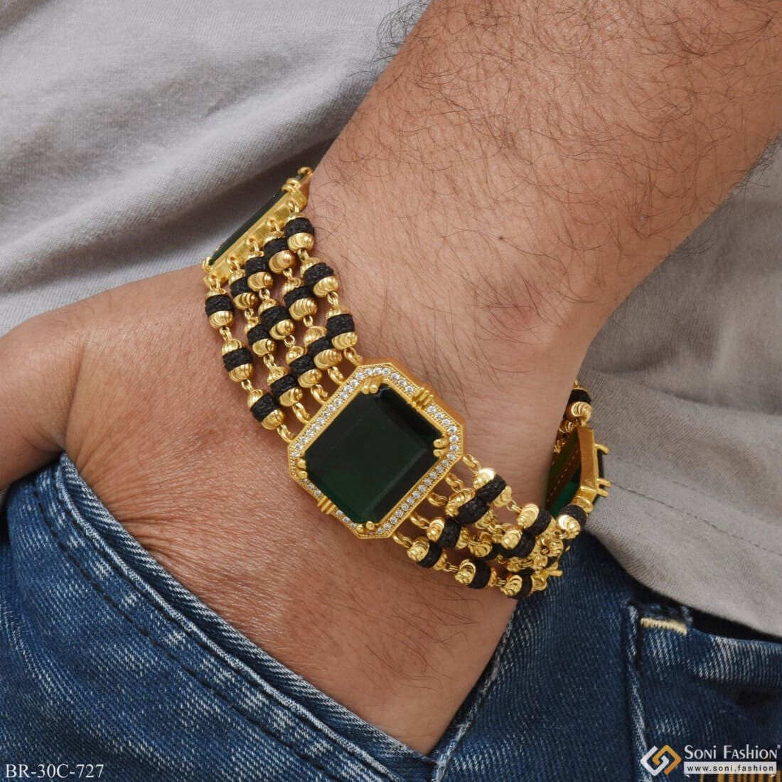 Gold bracelet with hot sale green stone