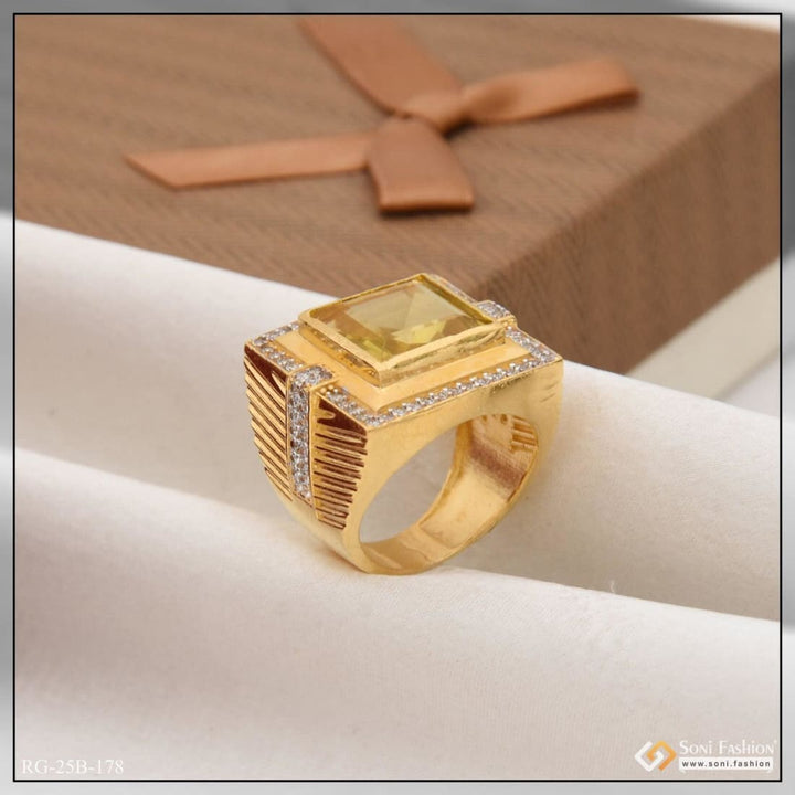 Gold-plated men’s ring with yellow sapphire and diamond detailing.