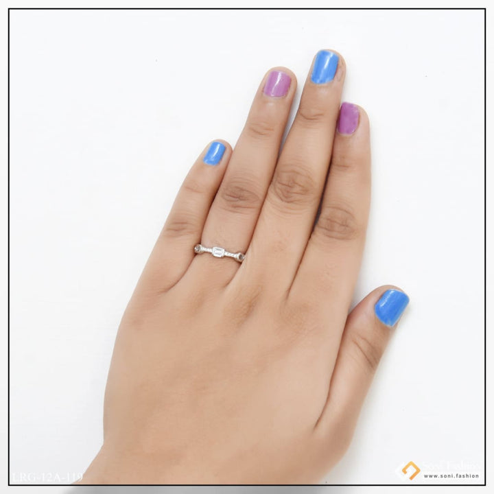 Woman’s hand with blue mani and diamond ring on 92.5 sterling silver decorative design ring.