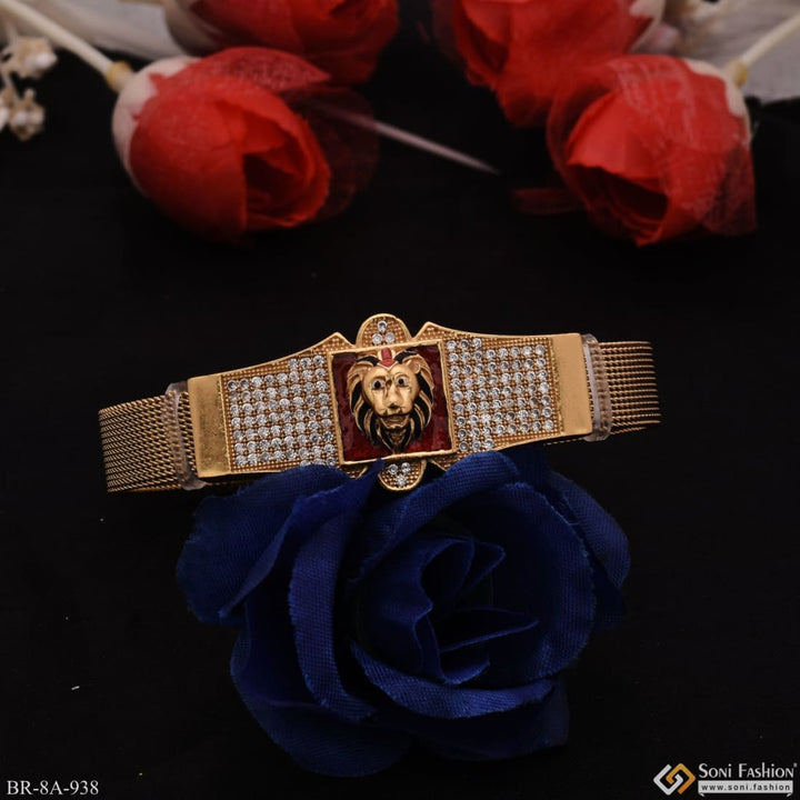 Gold plated stainless steel bracelet with lion head design on red background