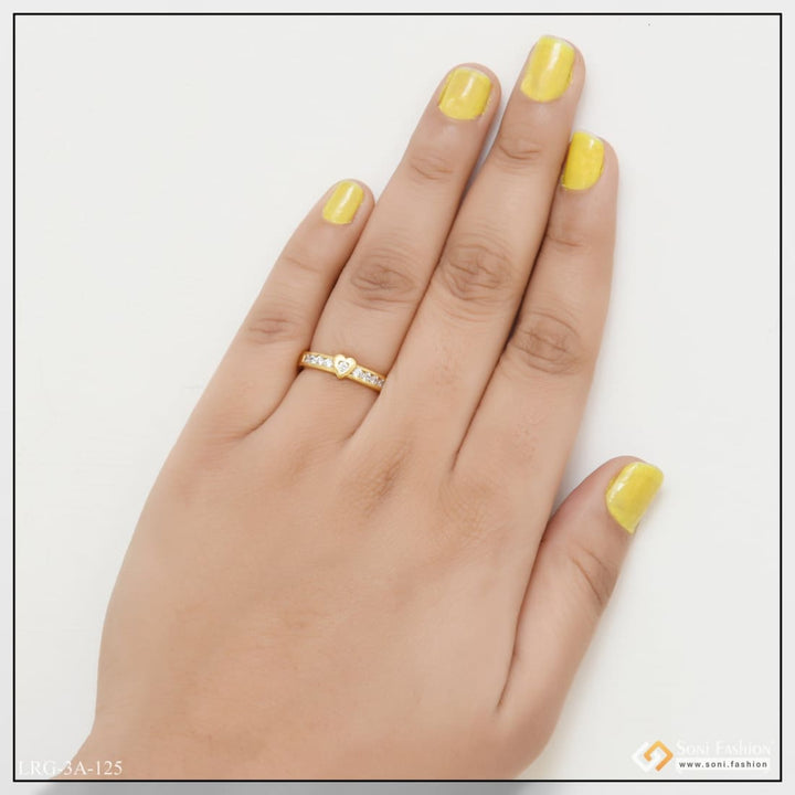 Gold plated ring with yellow mani and gold ring on woman’s hand from Heart with Diamond Eye-Catching Design product.