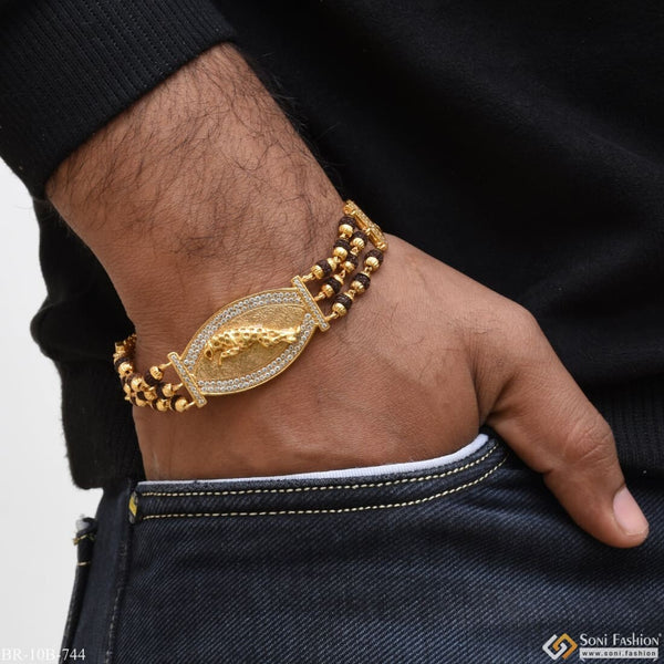 Gold plated bracelet with coin charm - unleash your wild side with Jaguar With Diamond B744.