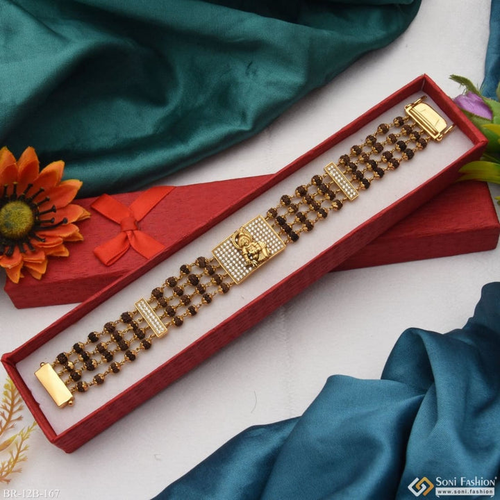 Gold plated Krishna bracelet with red box and flowers