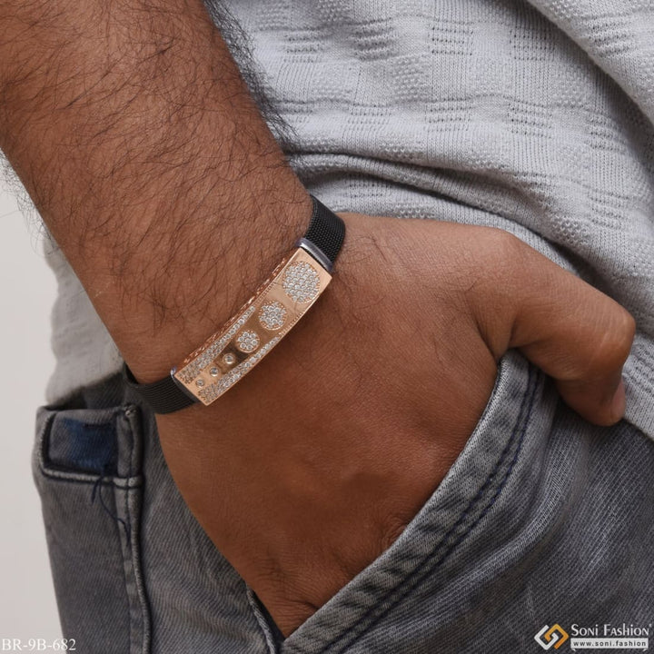 Rose gold bracelet with diamonds on man.